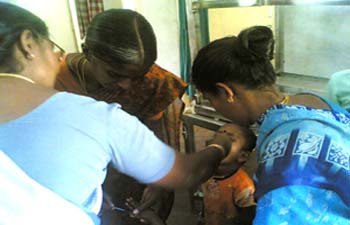 Polio drops administered for a child 