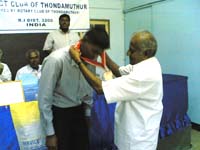 Charter President Rtn.Natraj collaring Rtr.Finny