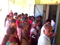 A part of the crowd and patients in the camp